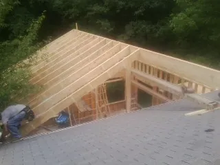 Framing a new roof addition that ties into an existing shingle roof in University Park