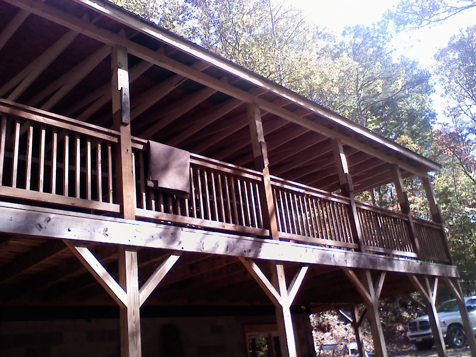 Timber framing under a new elevated porch and deck — Roof Leak Repair in University Park by Roofing Brothers